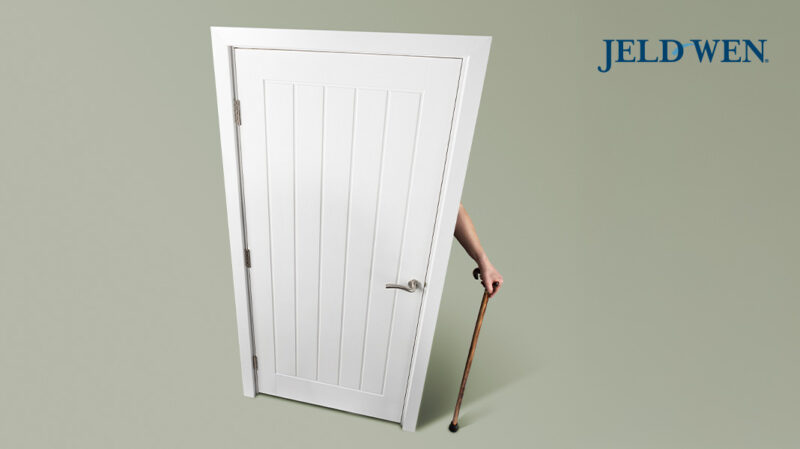 Image of a a door and a hand with a walking stick